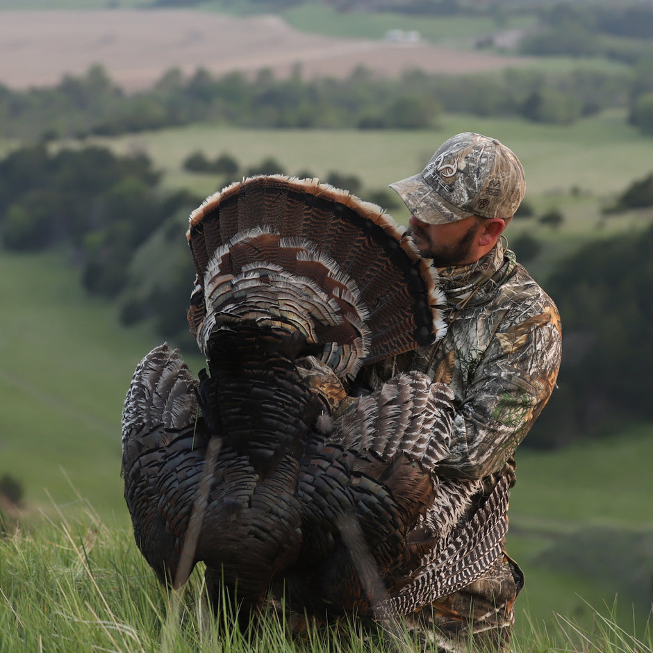 turkey hunter on top of hill