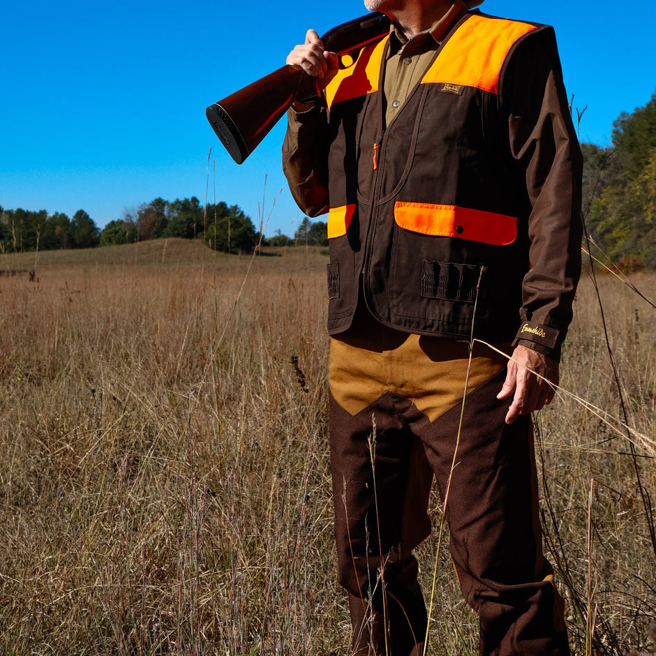 gamehide upland hunter wearing brush chap and lightweight vest