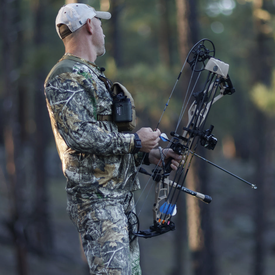 archer wearing unisulated clothing with bow